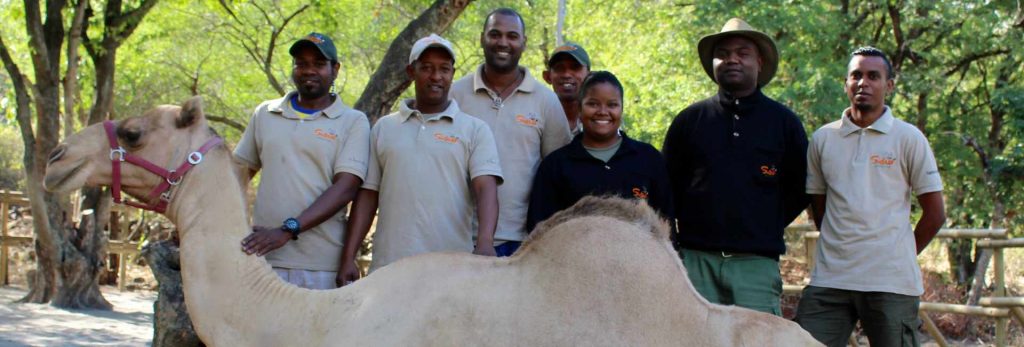 Safari Adventures staff with camel